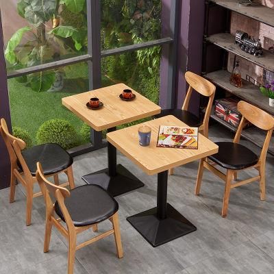High Quality Wooden Western Restaurant Furniture Dining Table and Chairs Square with Metal Base Solid Wood Frame Chair with Leather Seater