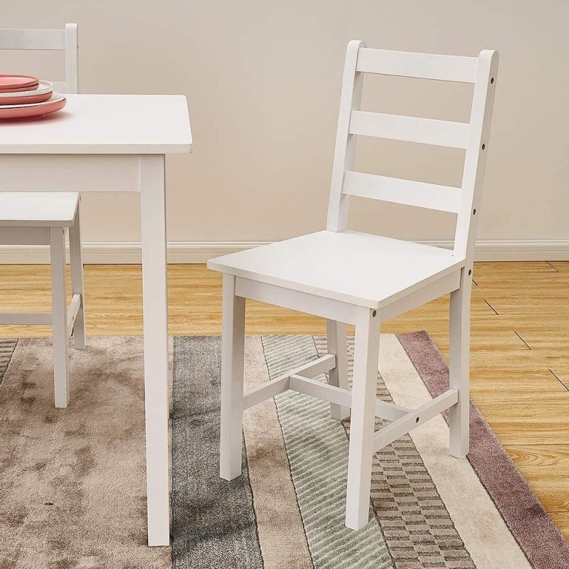 One table and four chairs in solid pine wood with white legs in natural color